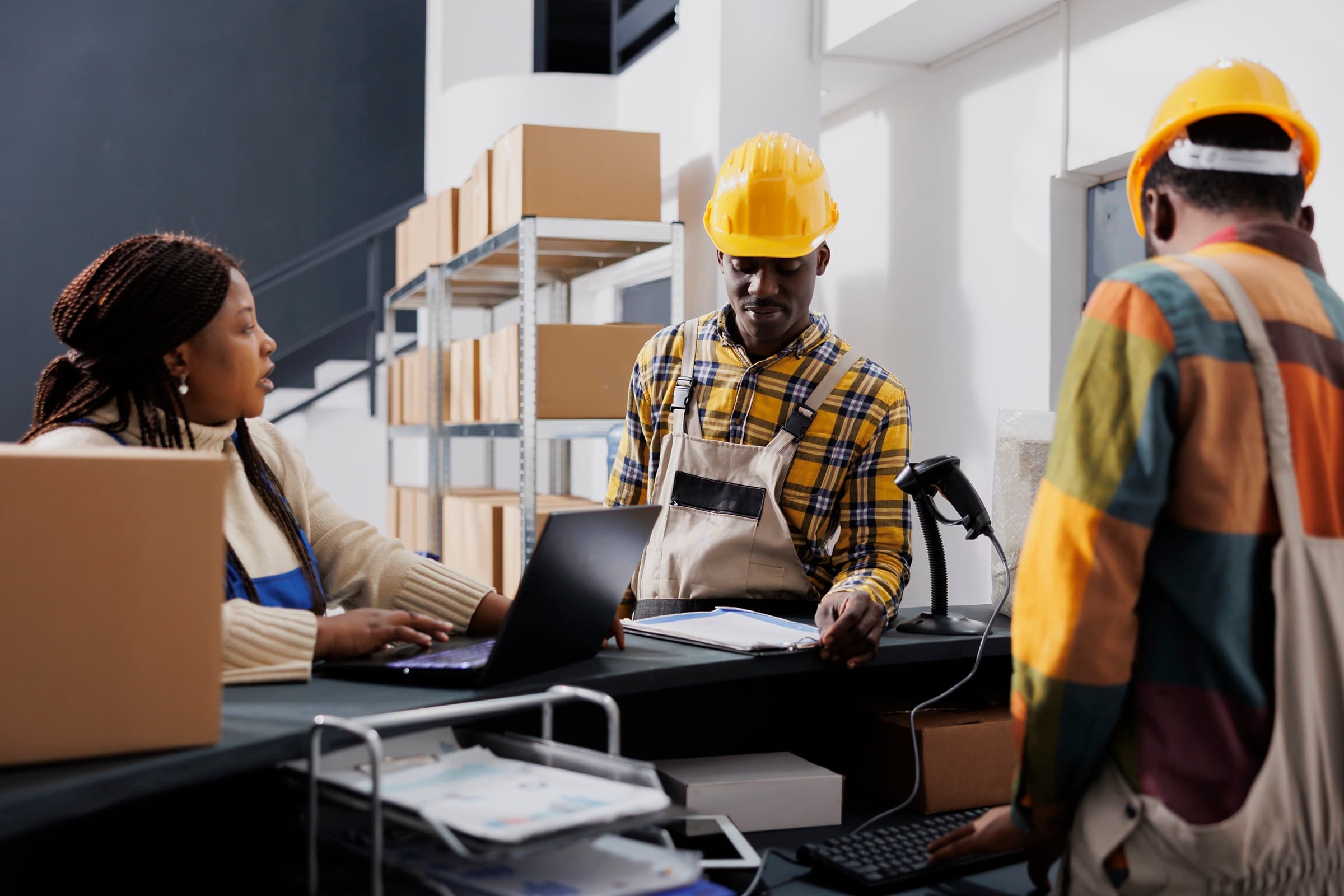 Duolink Logistics team coordinating a shipment at the warehouse counter