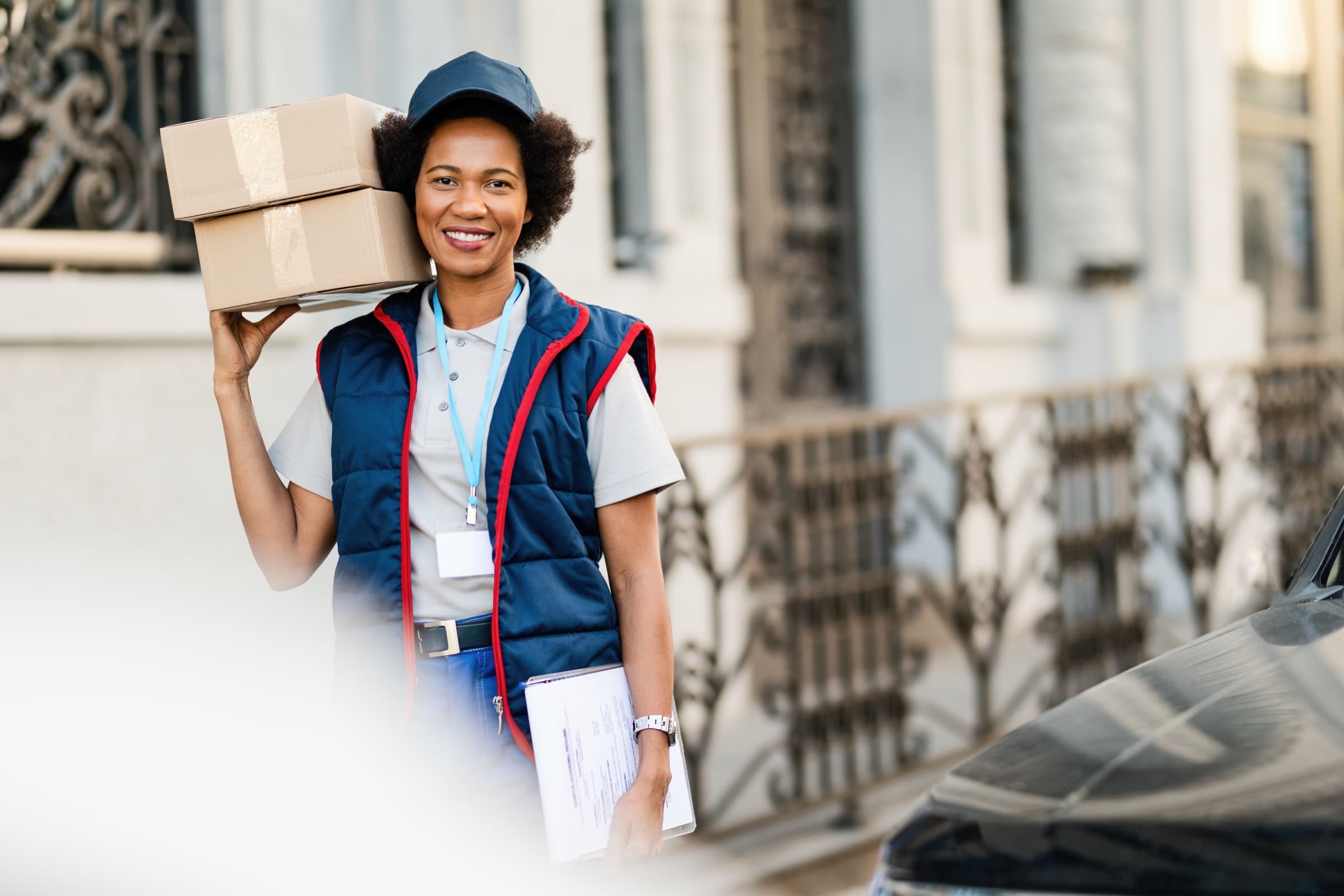 Duolink Logistics agent handing a delivery package directly to a customer